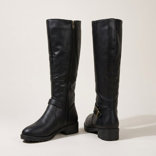 A pair of black leather knee-high boots with side zippers and buckle details, shown from the front and side angles on a light beige studio background.